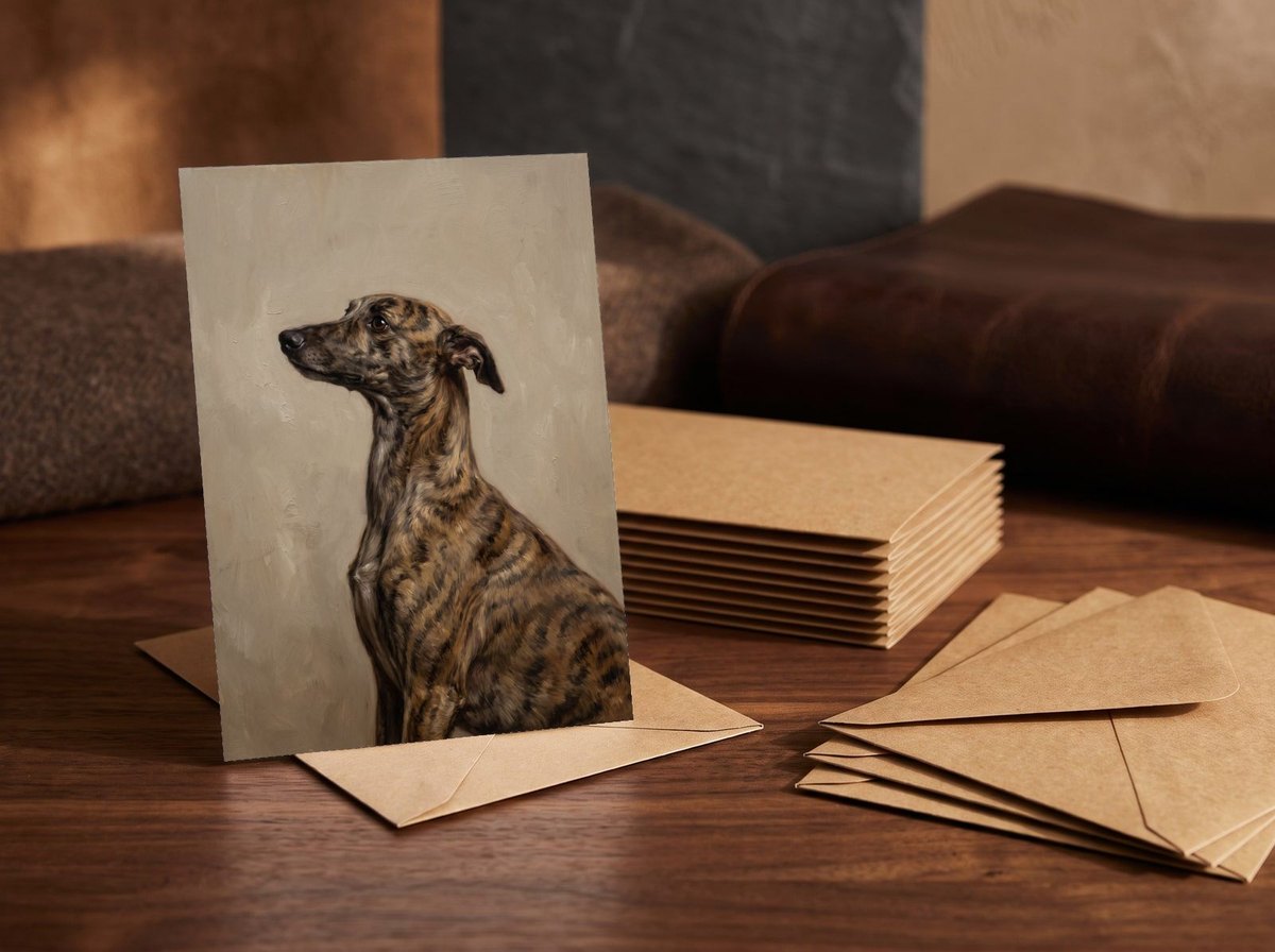 A card standing upright — in front of a stack of matching cards and fanned envelopes