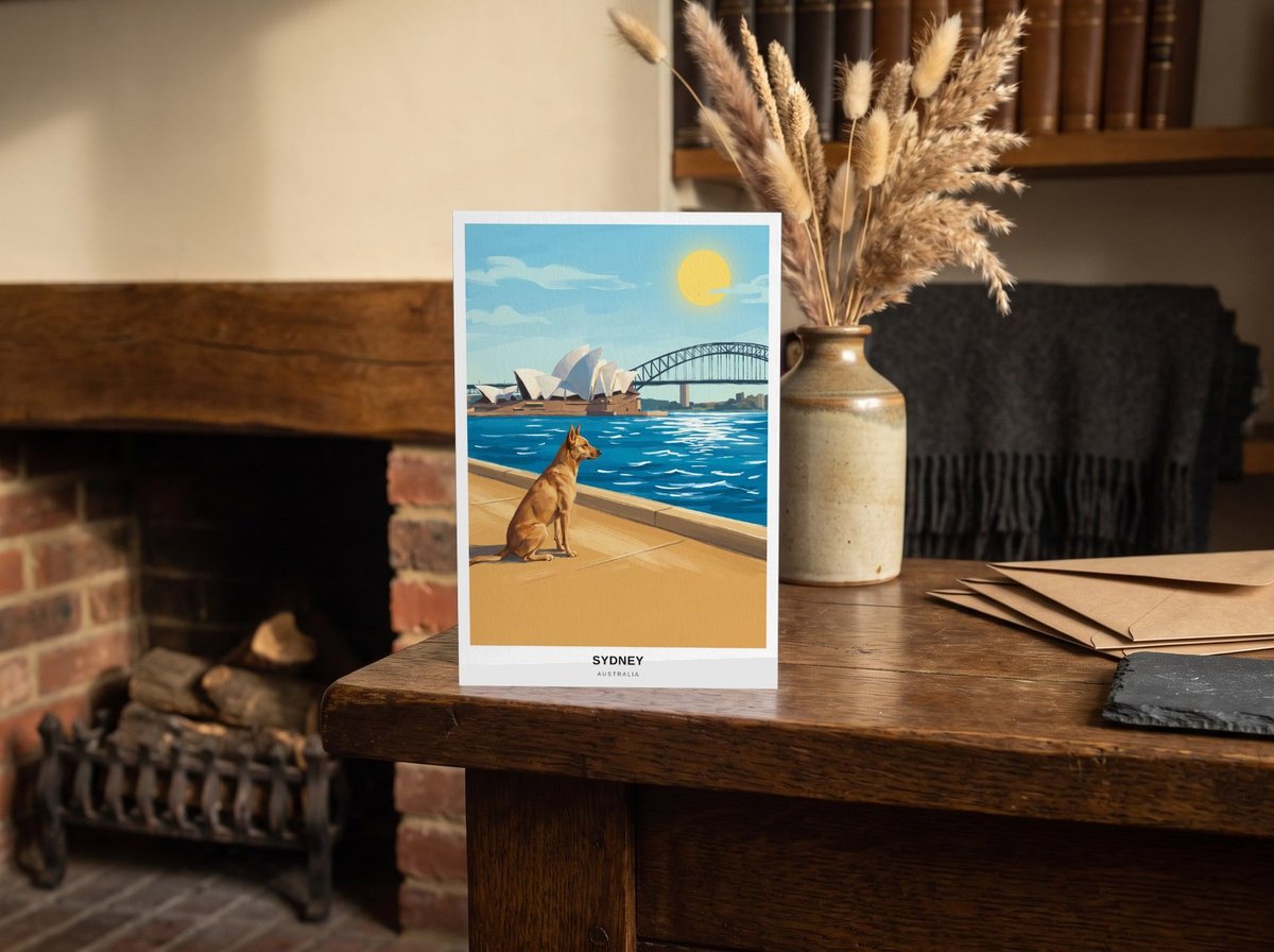 A card standing upright — on an oak mantel beside a vase of dried grasses