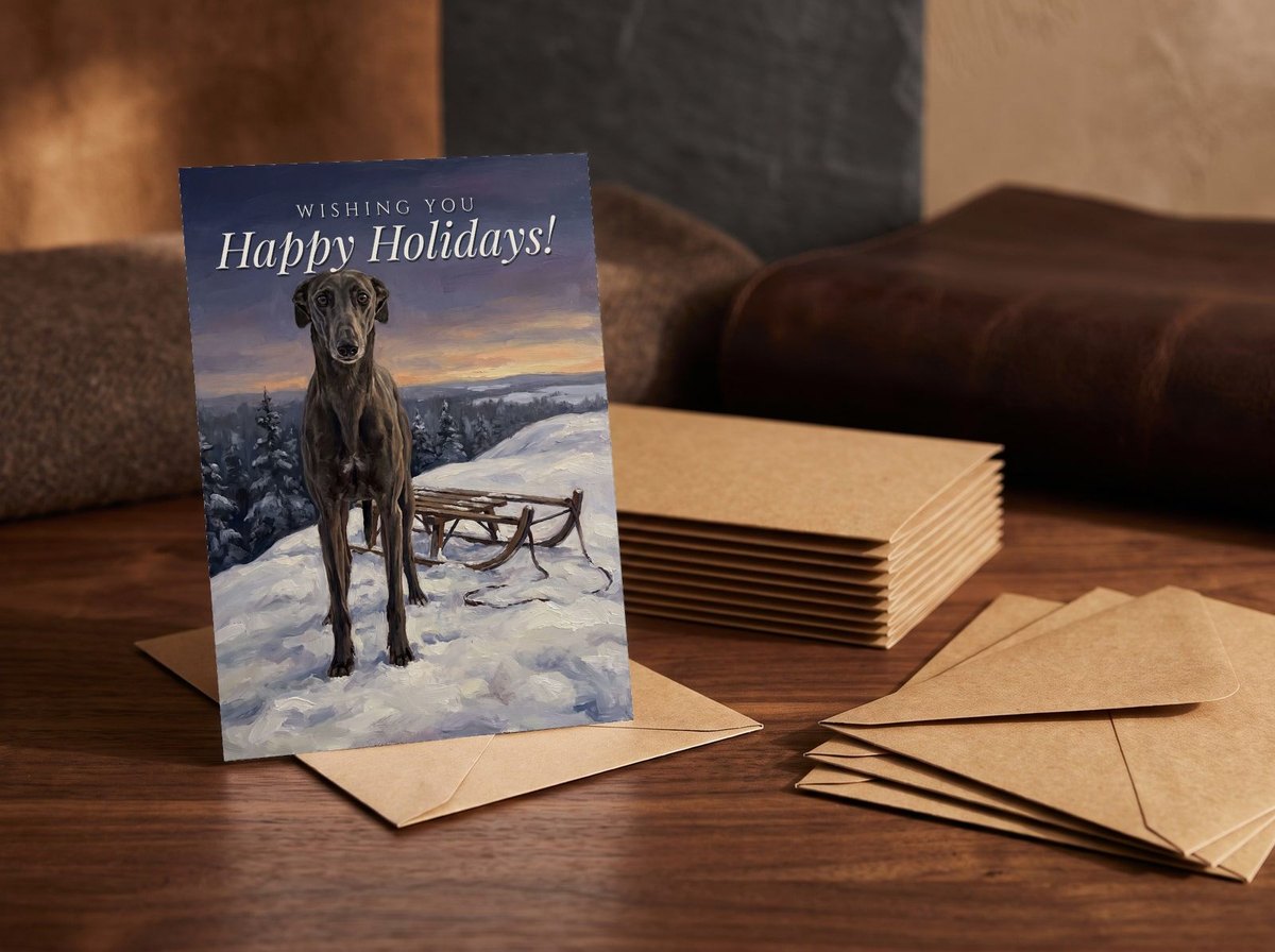A card standing upright — in front of a stack of matching cards and fanned envelopes