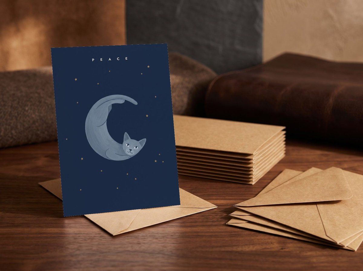 A card standing upright — in front of a stack of matching cards and fanned envelopes