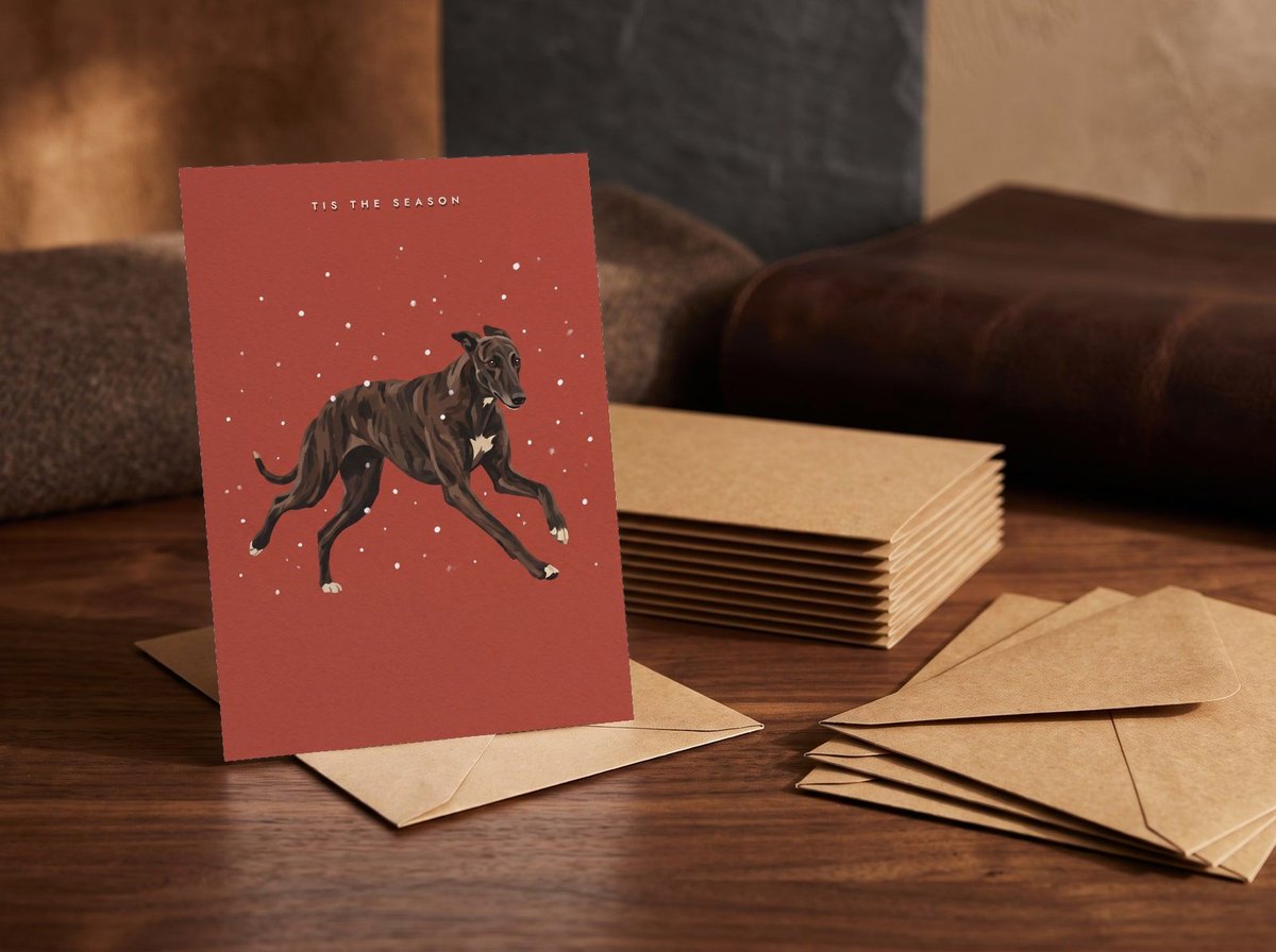 A card standing upright — in front of a stack of matching cards and fanned envelopes