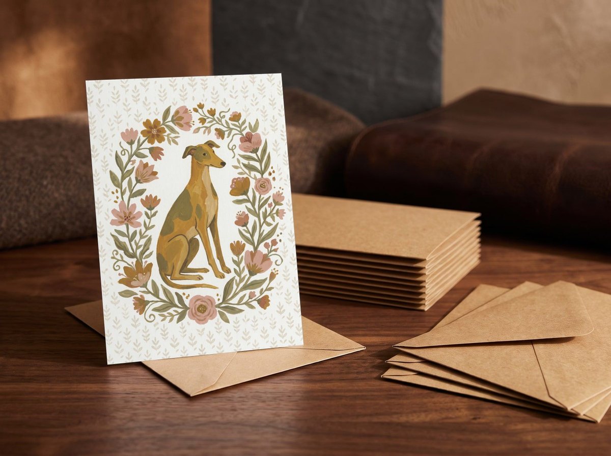 A card standing upright — in front of a stack of matching cards and fanned envelopes